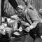 Posterazzi Woman Cooking Outdoors Poster Print, 18 x 24