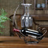 Homya Tabletop Metal Wine Bottle Rack, Elevated Vertical Countertop Organizer for 1 Bottle and 2 Glasses
