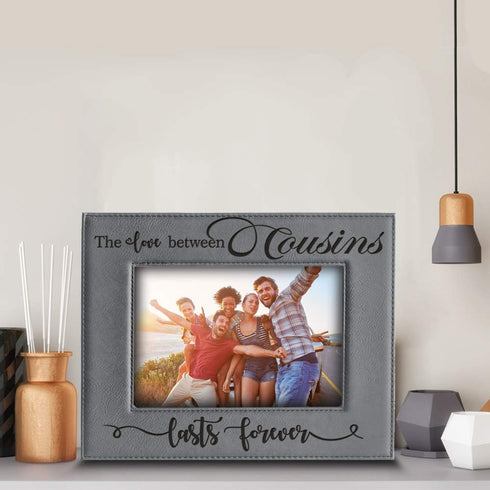 BELLA BUSTA Engraved Leather Picture Frame (5 x 7 Horizontal) - The Love Between Cousins Lasts Forever - Birthday,