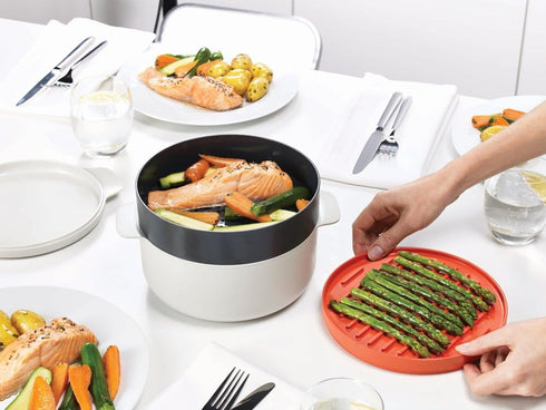 Joseph Joseph M-Cuisine 4-Piece Stackable Cooking Set, 2 Liter Cooking Pot, Steamer, Griddle, and Lid in Orange/Beige