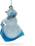 Snowman Riding a Sled - Blown Glass Christmas Ornament