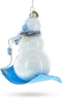 Snowman Riding a Sled - Blown Glass Christmas Ornament