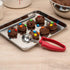 Restaurantware Comfy Grip 1.8 Ounce Portion Scoop: Ambidextrous Stainless Steel Disher with Ergonomic Handle