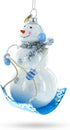 Snowman Riding a Sled - Blown Glass Christmas Ornament