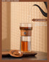ZENS Modern Glass Infuser Teapot, One Touch Tea Maker for Loose Leaf Tea with Insulated Mug and Portable Case.