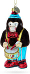 Fluffy Monkey Drumming Blown Glass Christmas Ornament