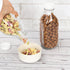 DHSBTLS 4 Pcs Glass Milk Bottles - 33.8 Oz Reusable Containers with Lid for Fridge, Airtight Heavy Duty Juice Jar