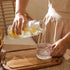 FQDGTFA 4-Piece Set 21.6 Oz 6 Oz Counter, Set Bedside Water Carafe and Glass, Glass Pitcher with Drinking Cup Lid