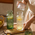 FQDGTFA 4-Piece Set 21.6 Oz 6 Oz Counter, Set Bedside Water Carafe and Glass, Glass Pitcher with Drinking Cup Lid