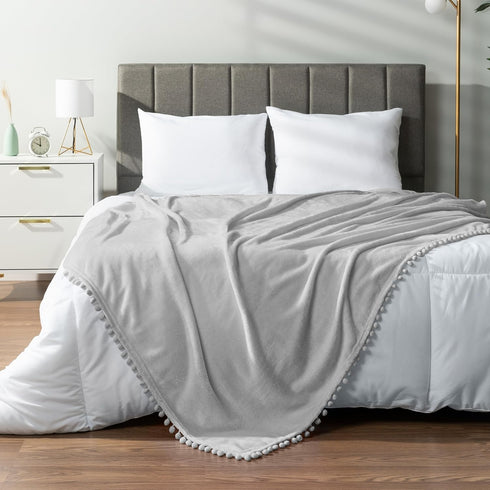 PAVILIA Light Grey Fleece Throw Blanket for Couch, 60x80 Inches, Soft Cozy Fuzzy Flannel Blanket with Pom Pom Fringe