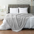 PAVILIA Light Grey Fleece Throw Blanket for Couch, 60x80 Inches, Soft Cozy Fuzzy Flannel Blanket with Pom Pom Fringe