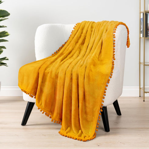 Cozy 50x60 Inches PAVILIA Fleece Throw Blanket for Couch with Pom Pom Fringe, Mustard Yellow, Soft Fuzzy Flannel