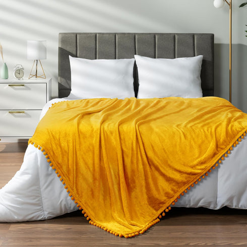 Cozy 50x60 Inches PAVILIA Fleece Throw Blanket for Couch with Pom Pom Fringe, Mustard Yellow, Soft Fuzzy Flannel