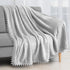 PAVILIA Light Grey Fleece Throw Blanket for Couch, 60x80 Inches, Soft Cozy Fuzzy Flannel Blanket with Pom Pom Fringe