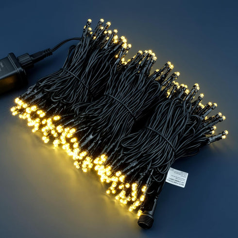 YULETIME 100 ft Warm White LED String Lights with 300 Count, 8 Models Adapter, Black Wire, 5mm Christmas Lights