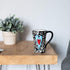 DEMDACO Tracy Pesche 15 Ounce Glossy Ceramic Stoneware Coffee Cup Mug with White Swirls Hearts