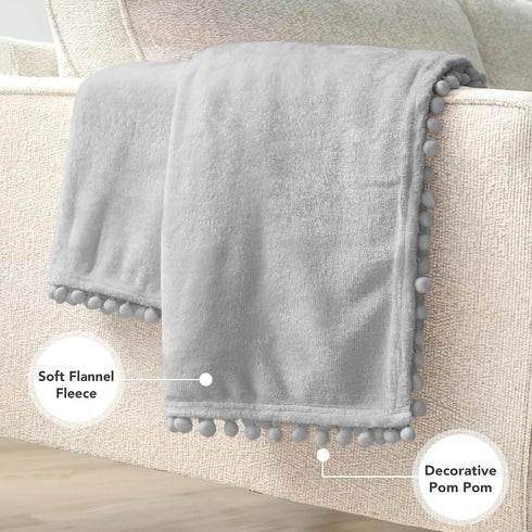 PAVILIA Light Grey Fleece Throw Blanket for Couch, 60x80 Inches, Soft Cozy Fuzzy Flannel Blanket with Pom Pom Fringe