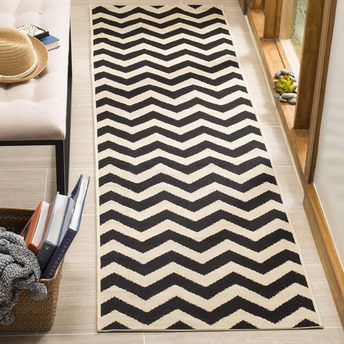 SAFAVIEH Courtyard Collection Runner Rug - 2'3" x 6'7", Black & Beige, Chevron Design, Non-Shedding & Easy Care,