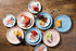 Set, 12-Piece Spice by Tia Mowry Goji Blossom Decorated Porcelain Chip and Scratch Resistant Dinnerware Blue