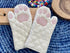 Cricket & Junebug Oven Mitts, Cat Paws - White and Pink.